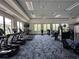 Bright fitness center with treadmills, elliptical, and weight machines, and fan at 15528 Corona Del Mar Dr, Wimauma, FL 33598