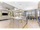 Spacious kitchen island with stainless steel appliances and a seamless view into the dining and living areas at 15528 Corona Del Mar Dr, Wimauma, FL 33598