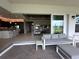 View from the lanai featuring sliding glass doors opening into the living room and kitchen at 15528 Corona Del Mar Dr, Wimauma, FL 33598