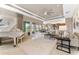 Elegant living room boasts high ceilings, neutral decor, and seamless indoor-outdoor flow at 15528 Corona Del Mar Dr, Wimauma, FL 33598