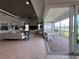 View from the living room to the covered lanai with access through sliding glass doors at 15528 Corona Del Mar Dr, Wimauma, FL 33598