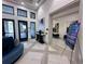 Welcoming lobby area with tile floors, comfortable seating and access to the Poolside Karaoke room at 15528 Corona Del Mar Dr, Wimauma, FL 33598