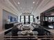A spacious lobby showcases modern decor, elegant furnishings, and a grand chandelier, creating a welcoming atmosphere at 15528 Corona Del Mar Dr, Wimauma, FL 33598