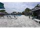 Resort-style pool area with ample seating, shady cabanas and meticulously maintained landscaping at 15528 Corona Del Mar Dr, Wimauma, FL 33598