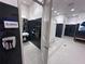 Modern restroom design with black tile and sleek fixtures at 15528 Corona Del Mar Dr, Wimauma, FL 33598