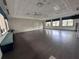 Spacious yoga studio with barre equipment, ample natural light, and padded flooring at 15528 Corona Del Mar Dr, Wimauma, FL 33598