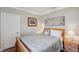 Welcoming bedroom with wood floors, side tables, and a window for natural light at 1617 El Pardo Dr, Trinity, FL 34655