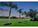 Scenic view of the golf course with mature trees and lush greenery creating a peaceful backdrop at 1617 El Pardo Dr, Trinity, FL 34655