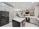 Open kitchen layout showcases a large island, stainless steel appliances, and backyard view at 1617 El Pardo Dr, Trinity, FL 34655
