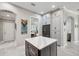 Bright kitchen boasts an island with marble countertop, stainless appliances, and plenty of cabinet space at 1617 El Pardo Dr, Trinity, FL 34655