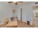 A bedroom with a desk and a closet at 1710 Belleair Forest Dr # A, Belleair, FL 33756