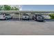 Covered parking with various vehicles parked underneath at 1710 Belleair Forest Dr # A, Belleair, FL 33756
