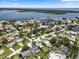 Picturesque aerial view of neighborhood homes, waterfront canals, and the tranquil bay at 1851 Oklahoma Ne Ave, St Petersburg, FL 33703