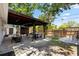 Backyard featuring a covered patio with barstool seating and a dining table on the brick-paved area at 1851 Oklahoma Ne Ave, St Petersburg, FL 33703
