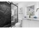 Modern bathroom featuring a glass-enclosed shower with black marble tile and a vanity at 1851 Oklahoma Ne Ave, St Petersburg, FL 33703