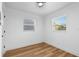 Neutral bedroom featuring hardwood floors, and two windows at 1851 Oklahoma Ne Ave, St Petersburg, FL 33703