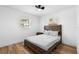 Neutral bedroom featuring hardwood floors, ceiling fan, and a bed at 1851 Oklahoma Ne Ave, St Petersburg, FL 33703