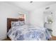 Comfortable bedroom with a queen-sized bed and an attached bathroom, creating a private retreat at 1851 Oklahoma Ne Ave, St Petersburg, FL 33703