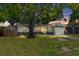 Charming single-story home featuring beautiful rock accents and a well-manicured lawn at 1851 Oklahoma Ne Ave, St Petersburg, FL 33703