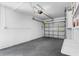 Clean garage with sealed concrete floor and white-painted block walls at 1851 Oklahoma Ne Ave, St Petersburg, FL 33703