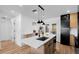 Contemporary kitchen island with breakfast bar, modern faucet and stainless steel appliances at 1851 Oklahoma Ne Ave, St Petersburg, FL 33703