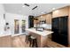 Modern kitchen with stainless steel appliances and a center island with bar stool seating at 1851 Oklahoma Ne Ave, St Petersburg, FL 33703