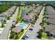 Aerial view of the community pool and clubhouse area in Montclair Lake with ample parking at 1962 Marlington Way, Clearwater, FL 33763