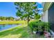 Beautiful lawn view of a pond in a community with landscaping at 1962 Marlington Way, Clearwater, FL 33763