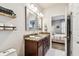 Bathroom with double sinks, granite countertop and views to the main bedroom suite at 1962 Marlington Way, Clearwater, FL 33763