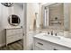 Stylish half bath with a modern vanity, mirror, and attractive light fixture at 1962 Marlington Way, Clearwater, FL 33763