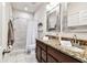 Bathroom features granite countertops, double sinks, walk-in shower and modern fixtures at 1962 Marlington Way, Clearwater, FL 33763
