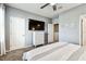Bedroom with a TV on a large dresser and multiple entrances for flexible use of space at 1962 Marlington Way, Clearwater, FL 33763