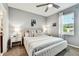 Serene bedroom with a plush bed, soft lighting, and a view from the bright window at 1962 Marlington Way, Clearwater, FL 33763