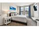 Comfortable bedroom with neutral decor, carpet, and an abundance of natural light at 1962 Marlington Way, Clearwater, FL 33763