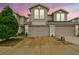 Inviting townhome featuring a spacious two-car garage and well-maintained landscaping at 1962 Marlington Way, Clearwater, FL 33763