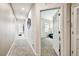 Upstairs hallway leading to bedrooms with carpet flooring at 1962 Marlington Way, Clearwater, FL 33763