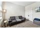 Home office space with a comfortable sofa and a bright window, ideal for work or relaxation at 1962 Marlington Way, Clearwater, FL 33763