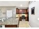 Modern kitchen featuring granite countertops and stainless steel appliances at 1962 Marlington Way, Clearwater, FL 33763
