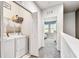 Upstairs laundry room with washer and dryer hookups and an open bedroom view at 1962 Marlington Way, Clearwater, FL 33763