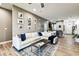 Open-concept living room with modern furnishings, dining area, and access to the kitchen at 1962 Marlington Way, Clearwater, FL 33763