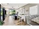Bright living room with sliding glass doors to a screened patio and water view at 1962 Marlington Way, Clearwater, FL 33763