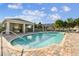 Sparkling community pool featuring a covered pavilion, well-maintained decking, and clear water at 1962 Marlington Way, Clearwater, FL 33763