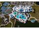 Community amenities include resort-style pool, tennis courts, and lush landscaping with beautiful ponds at 19652 Ship Wheel Way, Land O Lakes, FL 34638