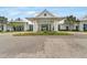 Inviting clubhouse entrance with manicured landscaping and a welcoming facade at 19652 Ship Wheel Way, Land O Lakes, FL 34638