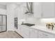 Modern white kitchen featuring stainless steel appliances, subway tile backsplash, and quartz countertops at 19652 Ship Wheel Way, Land O Lakes, FL 34638