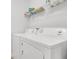 Well-equipped laundry area with modern washer and dryer units, with shelving for storage solutions at 19652 Ship Wheel Way, Land O Lakes, FL 34638