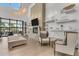 Bright lounge area with modern decor, comfortable seating, and stylish shelving units at 19652 Ship Wheel Way, Land O Lakes, FL 34638