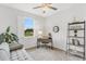 Bright office with a sleek desk, modern shelving, and a large window with shutters at 19652 Ship Wheel Way, Land O Lakes, FL 34638