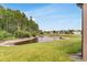 Scenic view of a tranquil pond surrounded by lush greenery, enhancing the property's appeal at 19652 Ship Wheel Way, Land O Lakes, FL 34638