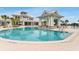 Beautiful community pool with a gazebo, lounge chairs, and clear, inviting waters at 19652 Ship Wheel Way, Land O Lakes, FL 34638